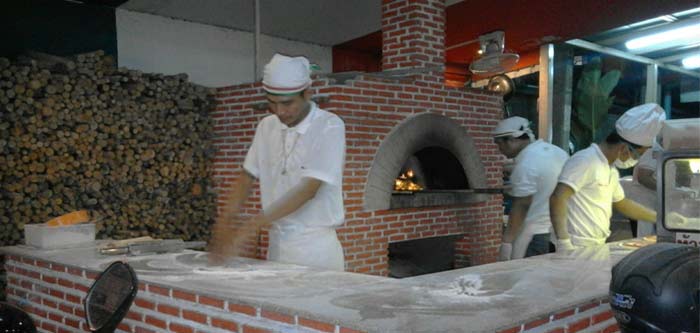 Staff attending pizza Staff oven