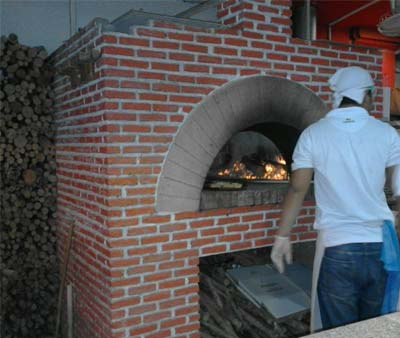 Making pizza with wood fired oven Wood fired oven